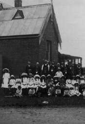 Pupils and their teachers pose for a photograph c. 1880s. Pupils and their teachers pose for a photograph c. 1880s.